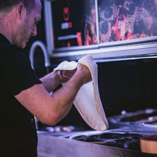 Chef preparing Mostro Pizza dough